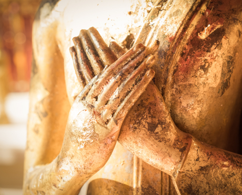 Close up hand of statue Buddha.buddhism concept